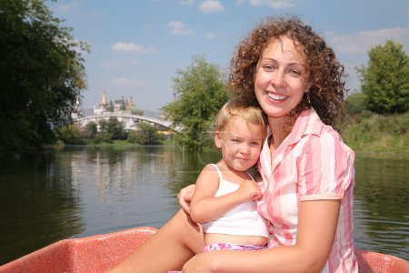 Mother with the daughter in the boat