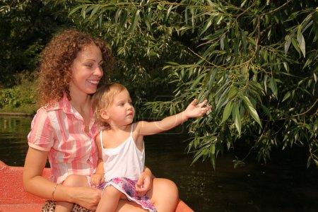 Mother with the daughter in the boat 2