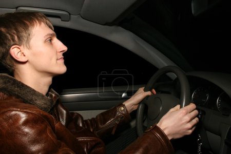 Man in car at night