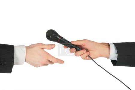Hand takes microphone from another