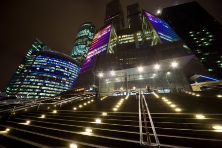 Facade of modern office building at night, skyscraper in moscow,