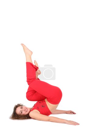 Yoga woman lies , legs up