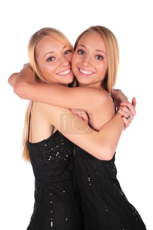 Twin girls embracing