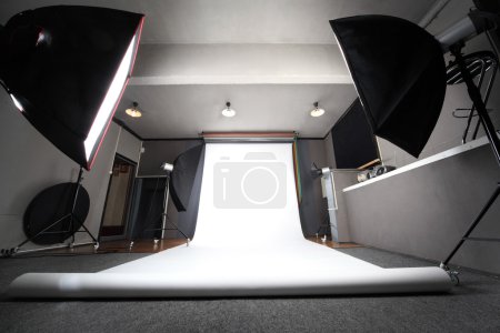 Interior of professional photo studio with white background gene