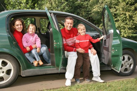 Family sitting in car