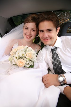 Bride and fiance in the car