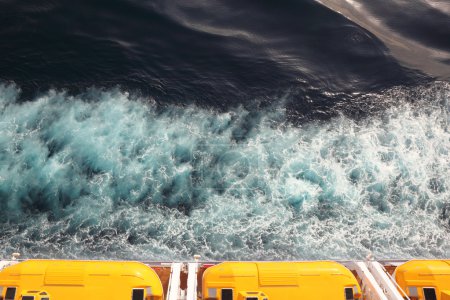 Escape boats with yellow roof on cruise ship view from above