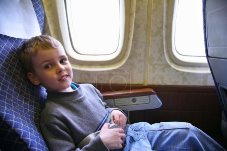 Child sit in plane