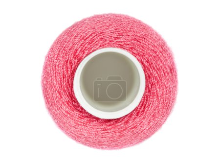Coil with red sewing threads isolated on white background, top v
