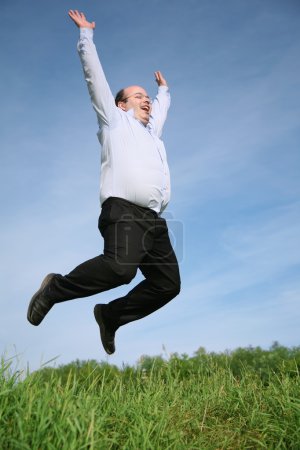 Man jumping grass