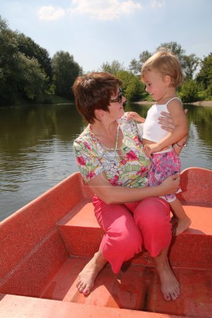 Woman with the girl in the boat