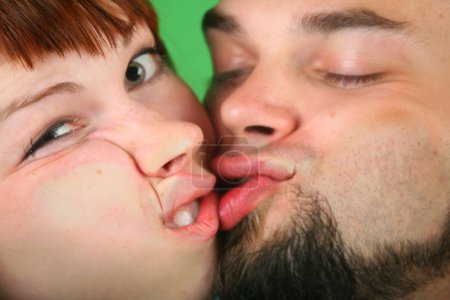 Close up girl with red hair and guy grimace