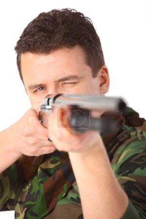 Man in camouflage pointed from gun