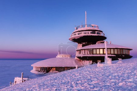 The peak of the Snezka Mountain in winter in the Krkonose Mountains. Snezka, Krkonose mouintain. Snezka hill after a sunset tinged in beautiful pastel colors view from Poland side. Czech Republic,