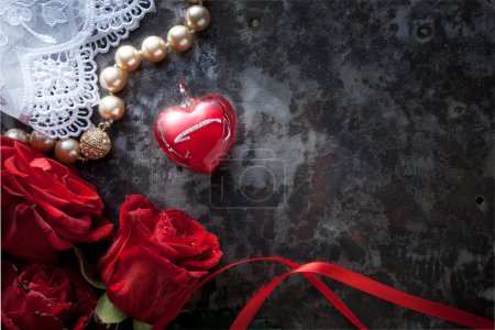 Art valentines greeting card with red roses and red heart on dar