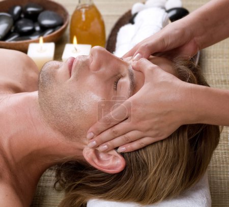 Spa. Young Man Getting Face Massage