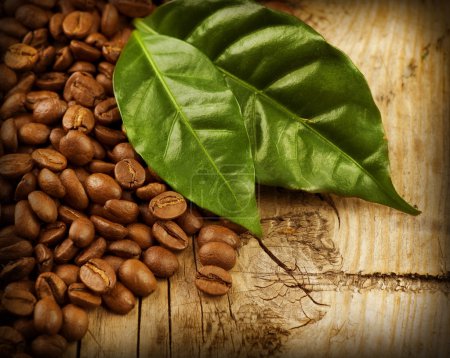 Coffee Beans over Wood Background