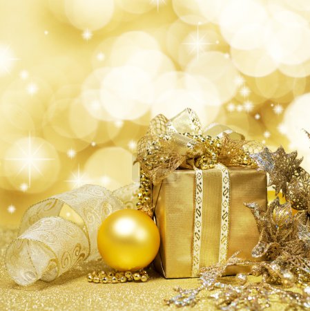 Christmas Decoration over Glittering Golden Background