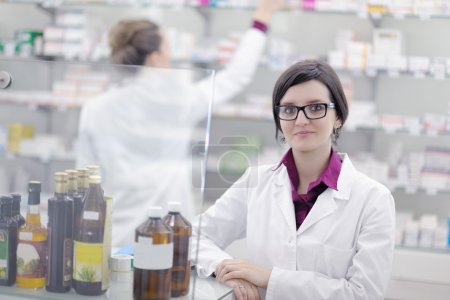 Team of pharmacist chemist woman in pharmacy drugstore
