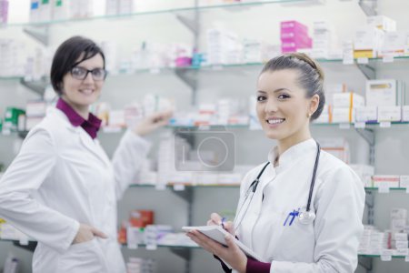 Team of pharmacist chemist woman in pharmacy drugstore