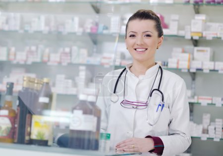 Pharmacist chemist woman standing in pharmacy drugstore
