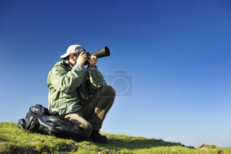 Nature photographer with digital camera