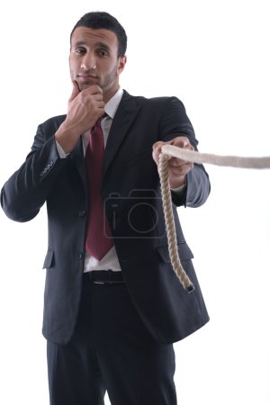 Business man with rope isolated on white background
