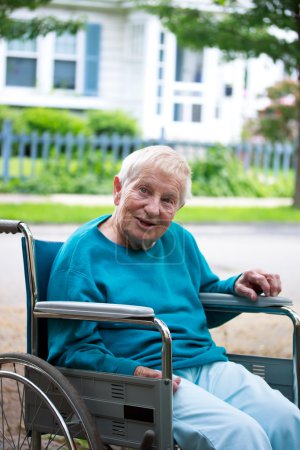Happy senior lady in wheelchair