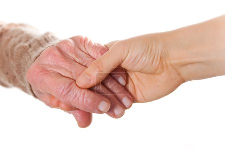 Senior and Young Women Holding Hands