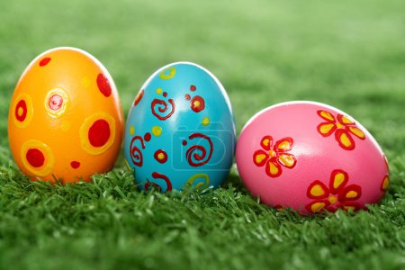 Colored eggs on lawn