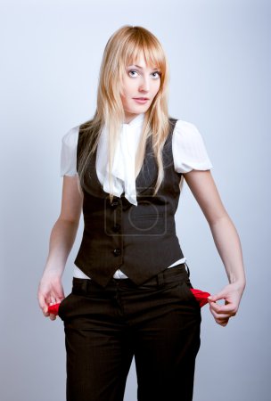 Young business woman showing empty pockets