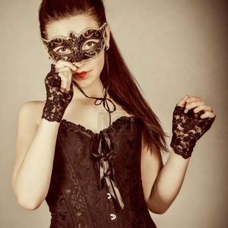 Cute girl in masquerade mask