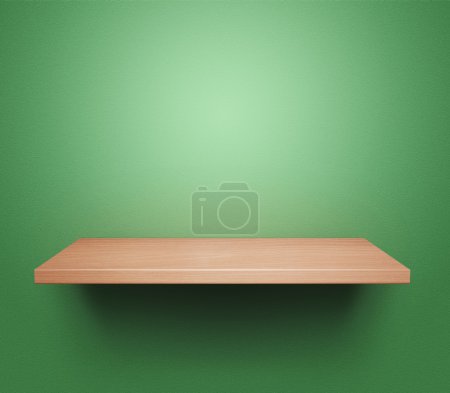 Empty shelf at green wall
