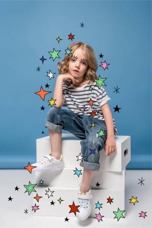 Little girl with drawn stars