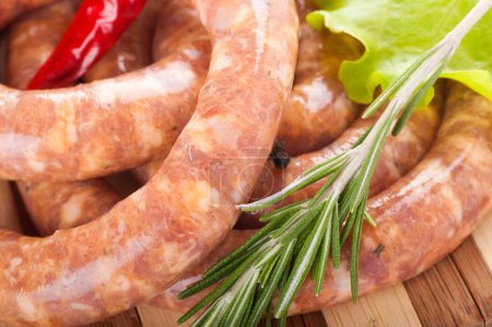 Sausage from pork and beef, tomatoes, salad and spices