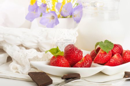Strawberry with a mint and jug of milk, chocolate