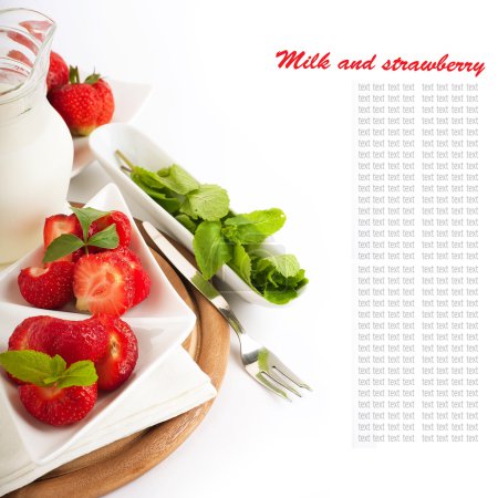 Strawberry with a mint and jug of milk on a white serviette