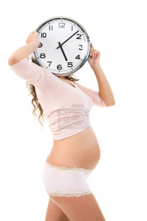 Pregnant female with clock
