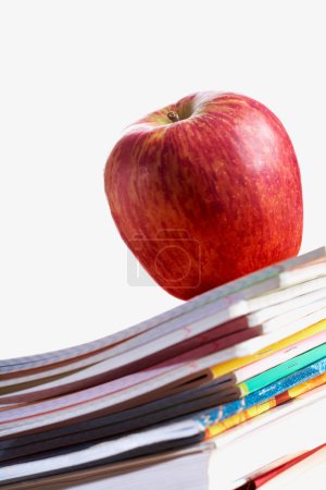 Red apple on copybooks