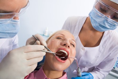 Examining oral cavity