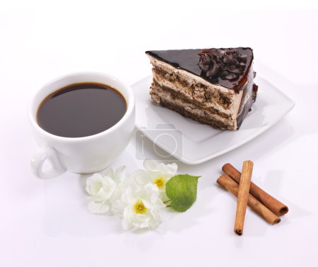 Chocolate cake, flowers and coffee